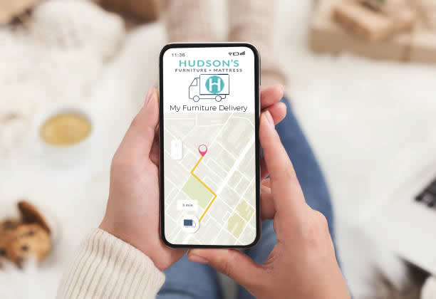 Person tracking their Hudson's delivery on a cell phone